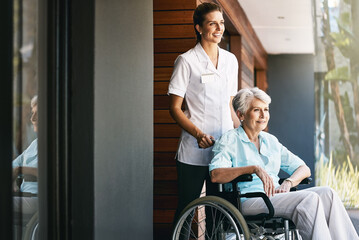 Wall Mural - Caregiver, senior woman and help on wheelchair for support, rehabilitation or medical healthcare of patient. Happy nurse, retirement and person with disability at home for recovery, wellness and care