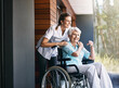 © ReadyAtTheEase/peopleimages.com - Nurse, senior woman and support on wheelchair for help or rehabilitation of medical healthcare patient. Happy caregiver, retirement and person with disability at home for recovery or care outdoor