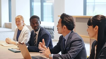 Poster - A group of multinational business people having a meeting