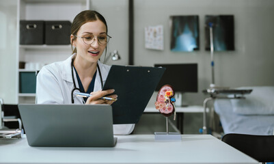 Medical Technology Concepts. The doctor is working on a tablet digital tablet computer in office  in the morning at the desk.