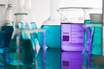 Sticker - Laboratory glassware placed in a table with liquid sample