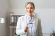 © Pixel-Shot - Young businesswoman with blank badge in office