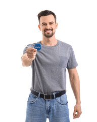 Wall Mural - Male volunteer with badge on white background