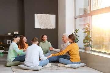 Poster - People holding hands on pillows at group therapy session