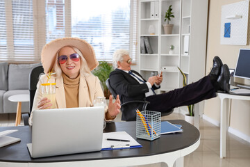 Sticker - Mature businesswoman with cocktail ready for summer vacation in office