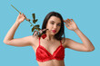 © Pixel-Shot - Beautiful young woman in sexy lingerie with rose flower on color background