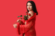 © Pixel-Shot - Attractive young woman in sexy lingerie with rose flower on red background
