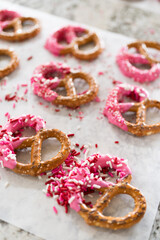 Wall Mural - Homemade Gourmet: Delightful Pretzels Adorned with Pink Chocolate and Sprinkles