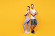 © ViDi Studio - Full body young confident cool strong fitness trainer sporty two man woman wear blue clothes spend time in home gym stand back to back isolated on plain yellow background. Workout sport fit concept.