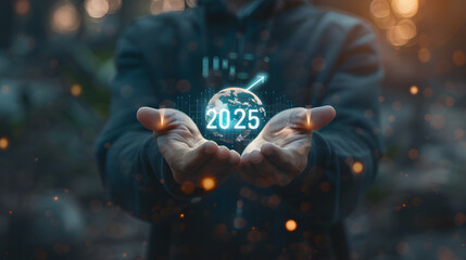 Wall Mural - Businessman holding a virtual hologram icon of a growth graph and arrow up with the text 2025 