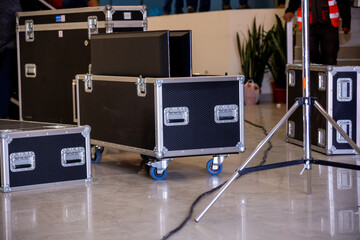 backstage of a concert, event, an open and closed flightcases on the floor