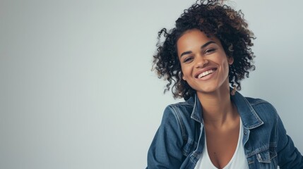 Wall Mural - Stylish Woman in Casual Chic Attire Posing Against White Background with Copy Space