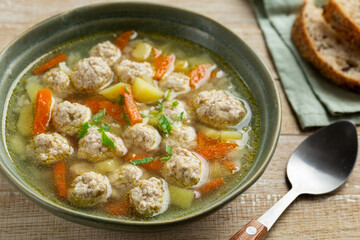 Wall Mural - meatball soup with vegetables