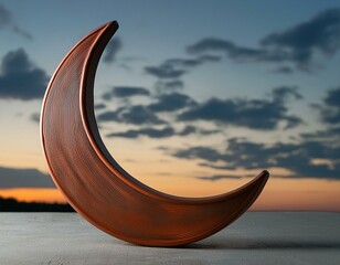 Wall Mural - a minimalist still life, with an abstract crescent moon-shaped ceramic vase against a soft dark sky background