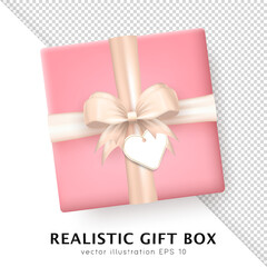 Wall Mural - Template of 3d realistic pink gift box with beige silk bow and hanging tag with space for greeting text. Three dimensional present wrap package with crossed ribbon and white empty label. Top view