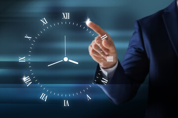 Wall Mural - Businessman touching virtual clock on dark background, closeup