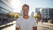 © rohappy - Portrait of happy smiling handsome young man standing in summer sunny city, male model on the street