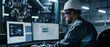 © Ai Studio - An engineer in a hard hat and protective glasses focuses intently on multiple monitors displaying complex industrial data.