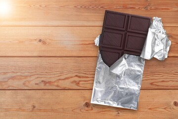 Canvas Print - Bitten tasty sweet milk chocolate rapped in foil