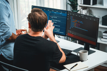 IT developers discussing online software development information on pc screen, creating program coding for latest version application on website. Concept of brainstorming firmware updated. Sellable.