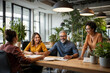 © Eduardo Accorinti - Multi ethnic group of people in business meeting, happy coworkers and ceo planning business strategy at work, smiling employees laughing and working in healthy working environment, successful company