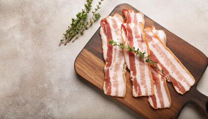 Wall Mural - Gourmet raw bacon slices with seasonings on wooden board. Natural and tasty product. Fresh meat.