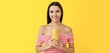 © Pixel-Shot - Pretty young woman with healthy juice on yellow background