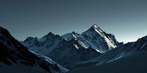 Canvas Print - Peak Majestic Rocky Mountain is snowy with a clear morning sky background.