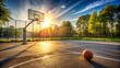 © Wanlop - Empty outdoor basketball court with hoop and net, freshly painted lines, and a lone basketball resting on the ground in warm afternoon sunlight.