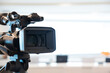 © Eakrin - Video camera with blur background for journalist interview broadcasting reporter news or press conference speaker or public speaking or meeting report record and content creator live media concepts.