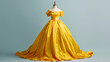 © Dominika - Butter yellow maxi dress -  A yellow satin ball gown with off-the-shoulder sleeves, on an empty mannequin for display. The full-length dress has a train at the back, giving it a classic silhouette.