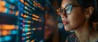 © VIK - A woman in glasses is reading html scripts, programming and cyber security research, as well as data analytics and holograms of data. An IT person in glasses is reading html scripts, programming and