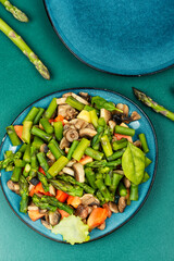 Wall Mural - Vegan green asparagus and mushroom salad.