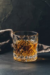 Poster - Glass of whiskey on a dark surface