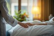 © Anastasiia S - Old woman patient lies in bed, a young nurse carefully holds her hand. Cozy nursing home room with soft lighting. Concept: calmness, hospital room, attentiveness, palliative care, hospice.