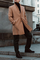 Wall Mural - Street style fashion cloth of beige brown men's coat. Classy urban outerwear