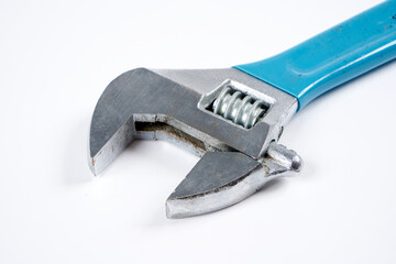 Adjustable wrench on an isolated white background.