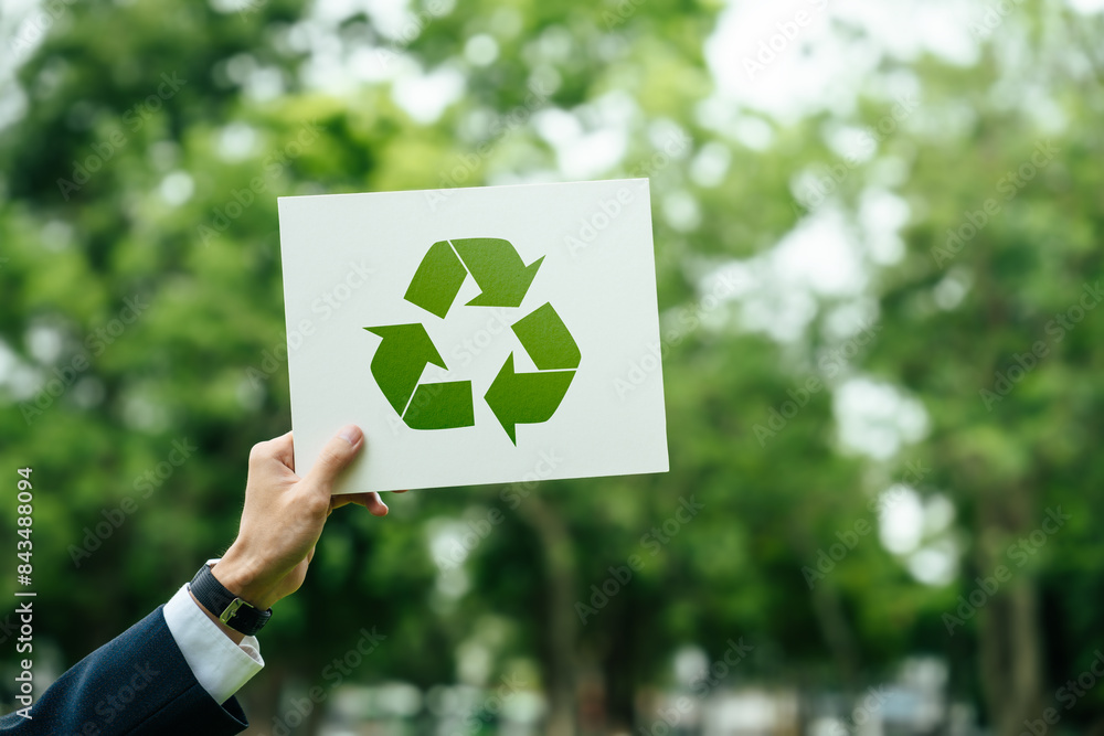 Businessman holding a sign recycle reuse reduce on nature background ...
