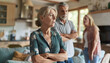 © Oleksiy - Woman ignoring her husband and mother-in-law standing behind and arguing with her at home