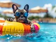 © Jakraphong - Playful French Bulldog Wearing Goggles on Rainbow Inflatable at Pool Party