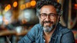 © Pixel Mind - Portrait of a man wearing glasses, smiling, with a beard