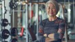 © gn8 - Mature East Asian Female Fitness Trainer in Modern Gym Setting, Promoting Healthy Lifestyle and Physical Activity