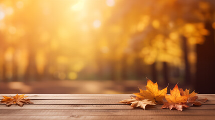 Empty wooden board top with a blurred background for autumn leaves