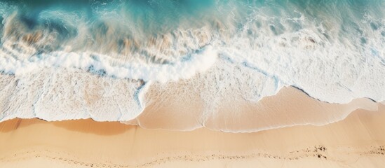  Top view of wet coastal sand with sea waves Sandy beach and ocean tide in a copy space image