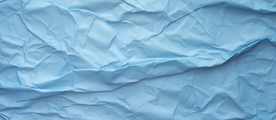 Poster - blue crumpled paper texture background. copy space available