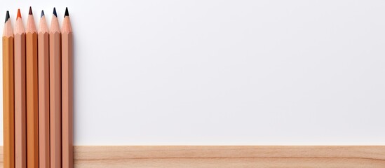 Aufkleber - Close up wooden pencil and notebook on white background. copy space available