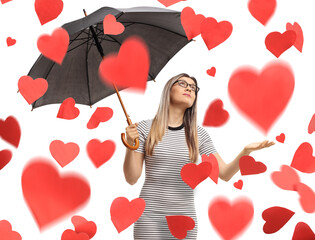 Sticker - Young woman with an umbrella under red hearts