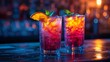 © svastix - Dynamic red colored cocktails with fresh orange slices and mint leaves, under vivid neon lights