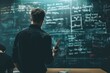 © kramynina - Man standing in front of a blackboard with writing on it