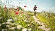 © spyrakot - Cyclist Enjoying a Spring Countryside Path with Blooming Flowers Under a Clear Sky - Ideal for Posters
